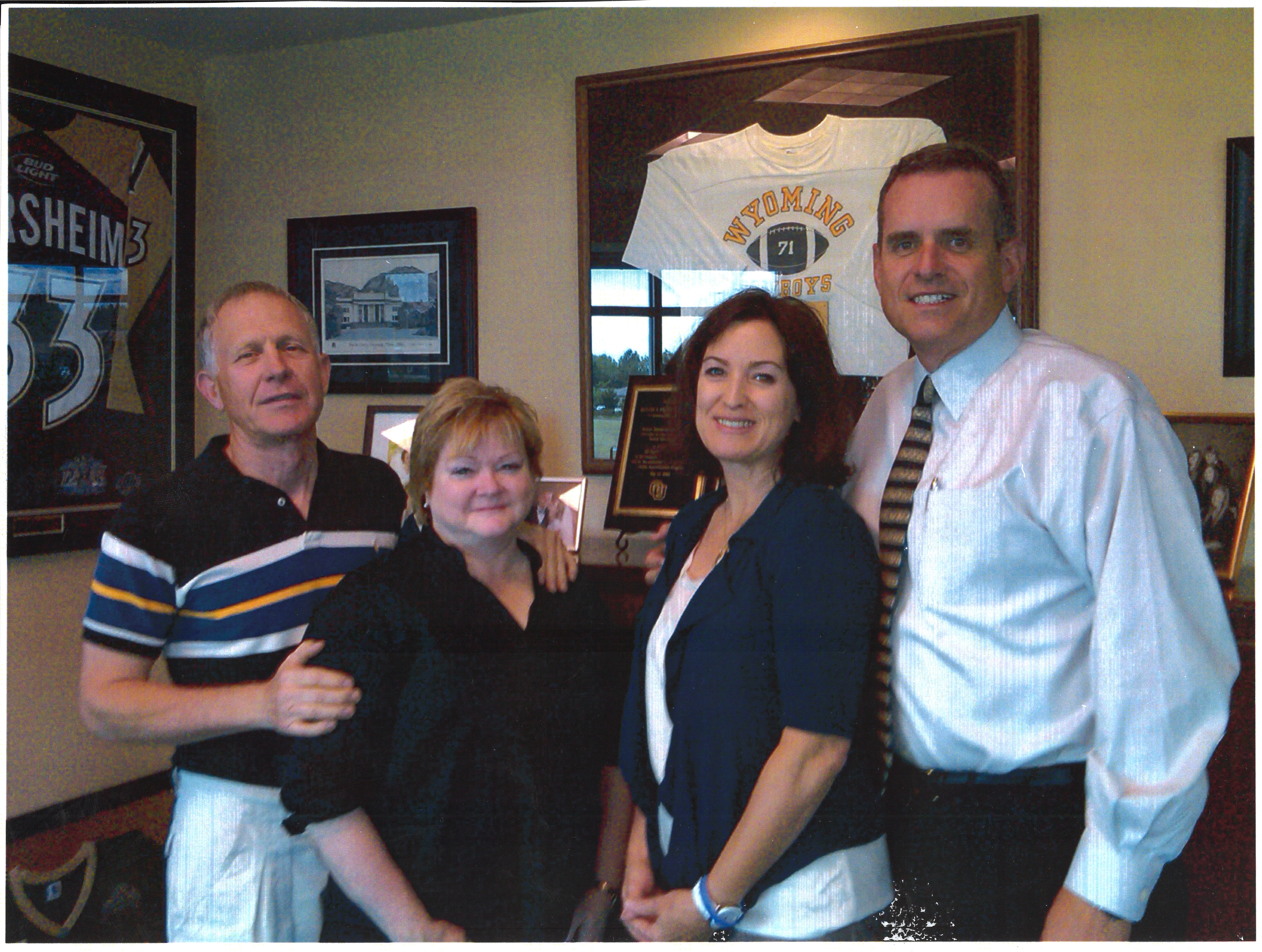 Dennis and Judy Shepard stand with Rulon Stacey and his wife